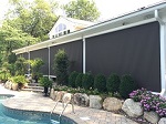 Exterior Solar Screen Shade elcosing a wrap around porch in Mahwah NJ